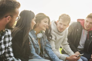 Young people having good time outdoors 