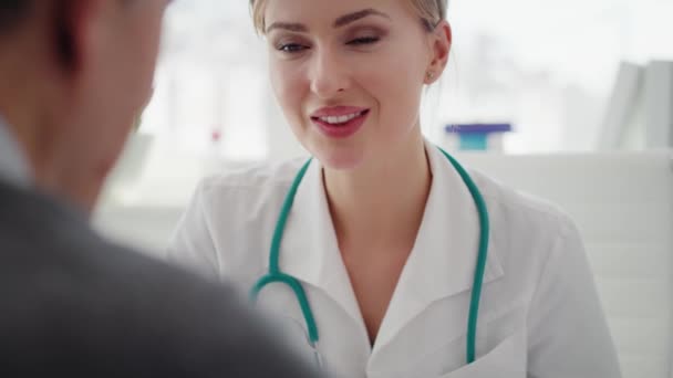 Handheld View Doctor Showing Examination Results Clipboard Shot Red Helium — Stock Video