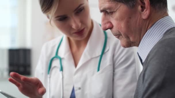 Handheld View Doctor Showing Examination Results Digital Tablet Shot Red — Stock Video