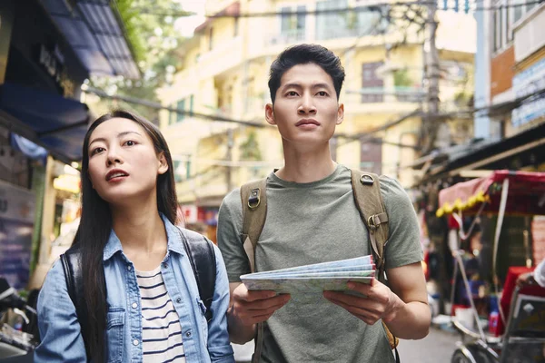 Young couple searching for places to visit