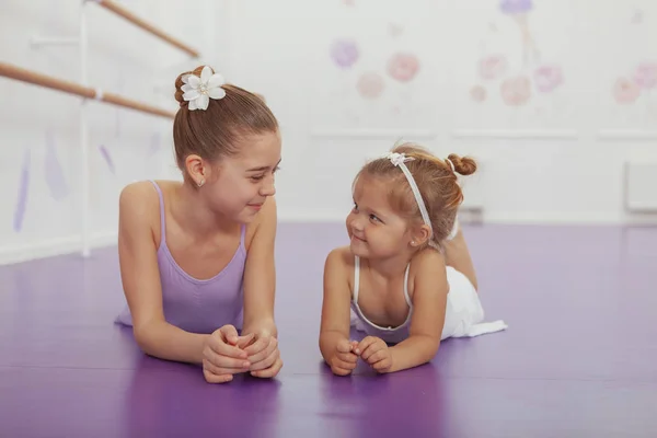 Charming two young ballerinas practicing at ballet class — Stock Photo, Image