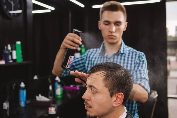 Mature man getting a new haircut at the barbershop — Stock Photo, Image