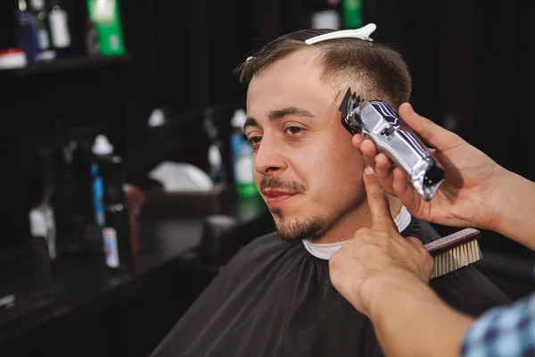 Mature man getting a new haircut at the barbershop — Stock Photo, Image