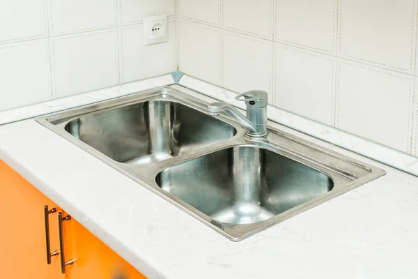 The photo of a sink in a The photo of a sink in a  kitchen — Stock Photo, Image