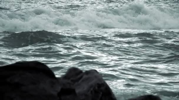 Evening Waves and Defocused Rocks in the Foreground. Slow Motion — Stock Video