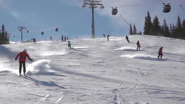 Ski Resort Sunny Weather Several Skiers Ski Downhill Slow Motion — Stock Video