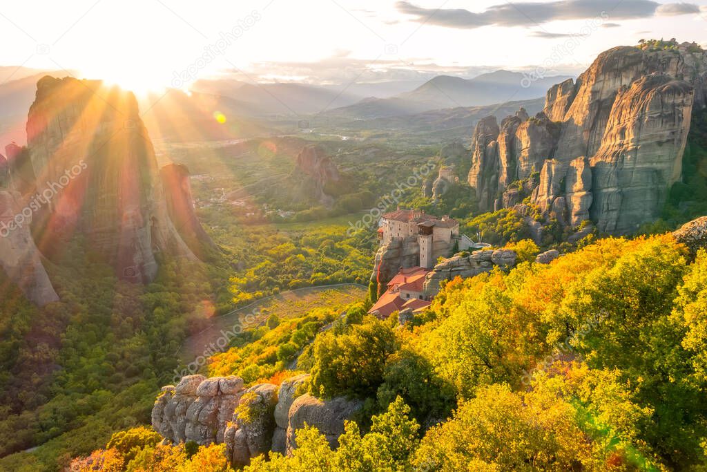 Greece. Summer sunset over valley of the rock monastery in Meteora (near Kalambaka) and sunbeams