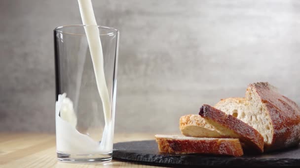 Several Slices Fresh Bread Lies Table Milk Poured Glass Slow — Stock Video