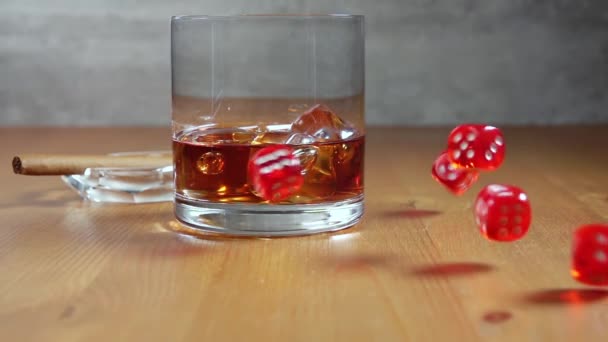 Glass Whiskey Ice Ashtray Cigar Wooden Table Dice Fall Slow — Stock Video