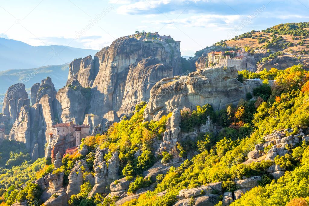 Greece. Sunny summer day in the Kalambaka Valley. Stone monasteries at the top of the cliffs