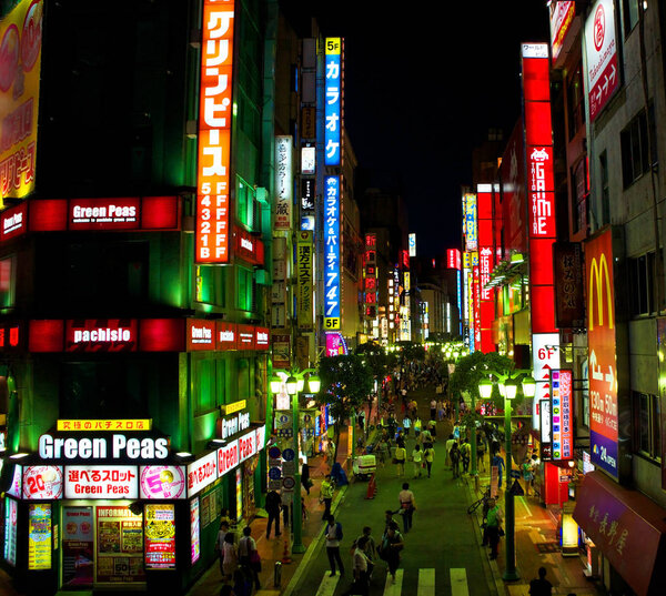 Tokyo, Japan - July 12, 2012 - The bright lights of Shinjuku, one of the most famous commercial districts in Tokyo and home to the world 's business railway station
. 