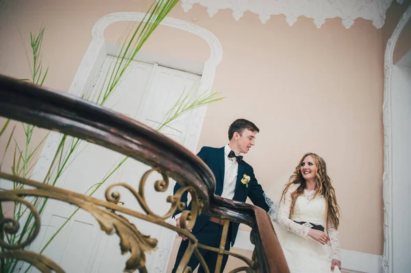 Stylish Elegant Bride Dancing Groom Stands Stairs Railing Patterns Doors — Stock Photo, Image