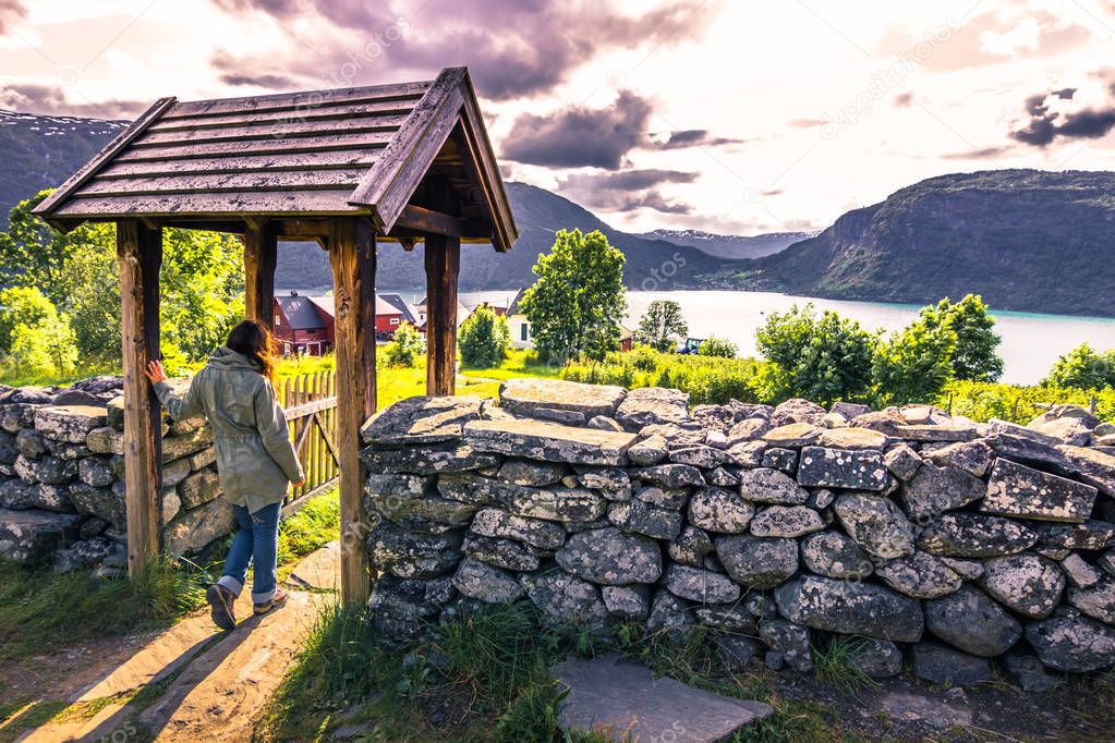 July 23, 2015: Traveller at the entrance to Urnes Stave Church, 