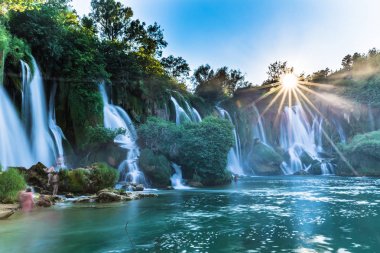 July 12, 2016: Sunset at the Kravica Waterfalls, Bosnia and Herz clipart
