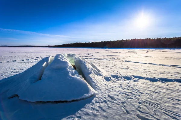 Falun - March 31, 2018: Ice formation at the frozen lake of Framby Udde near the town of Falun in Dalarna, Sweden