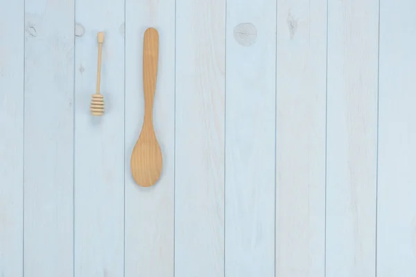 Kitchen items: spoons on blue wooden background. Above view