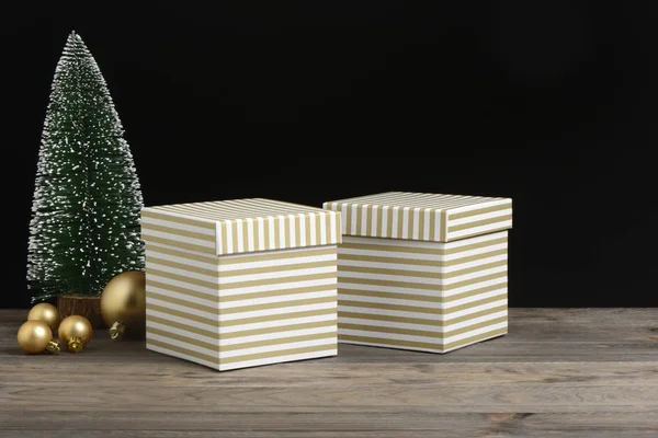 Golden White Striped Gift Boxes Wooden Black Background — Stock Photo, Image