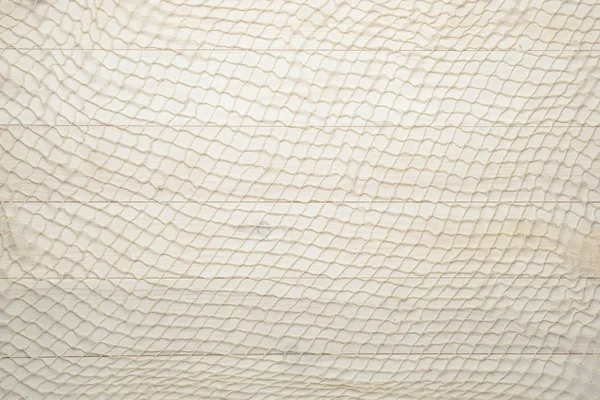 Red fishing net on white wooden background — Stock Photo, Image