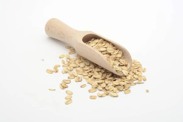 Вівсяне зерно в дерев'яній ложці — стокове фото