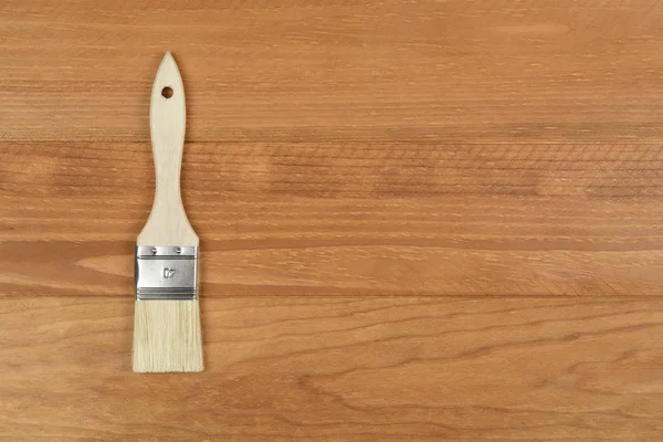 Cepillo sobre fondo de madera — Foto de Stock