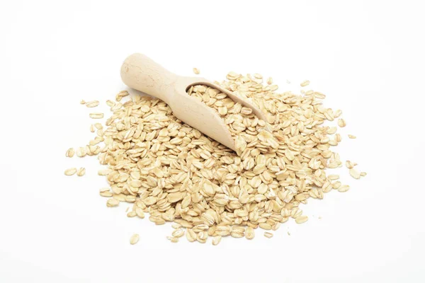 Вівсяні пластівці зерна в дерев'яній ложці — стокове фото