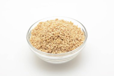 Golden linen in a transparent glass bowl