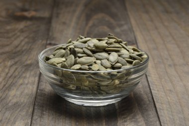 Peeled pumpkin seeds in a glass bowl