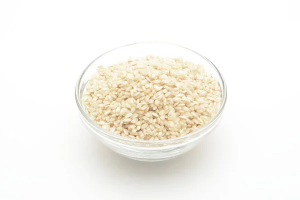 Bruine Rijst Een Glazen Kom Witte Achtergrond — Stockfoto