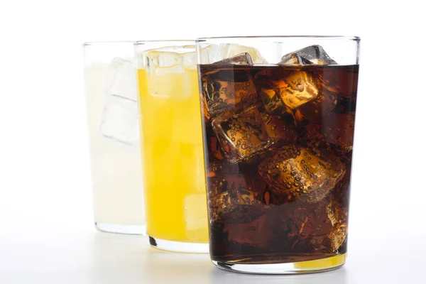 Glasses Soft Drinks Cola Orange Lemon Three Refreshing Drinks White — Stock Photo, Image