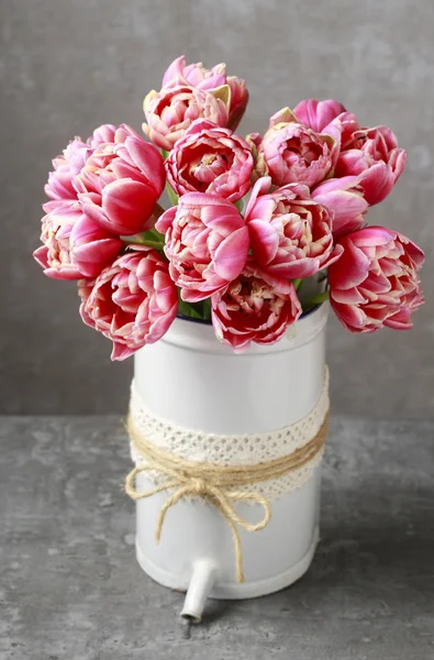 Bouquet of pink tulips in vintage can — Stock Photo, Image