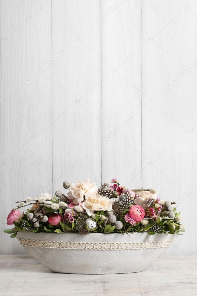 Floral arrangement with carnation and ranunculus flowers