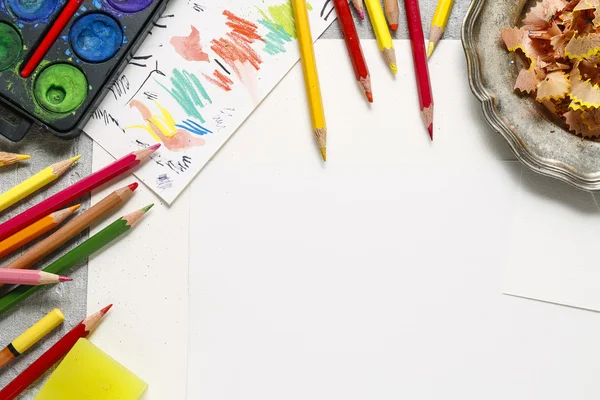 Watercolor paint box and colorful crayons — Stock Photo, Image