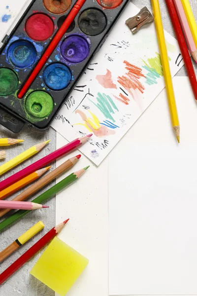 Watercolor paint box and colorful crayons — Stock Photo, Image