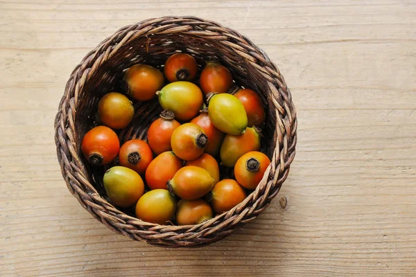 Basket of rose hip fruits — Stock Photo, Image