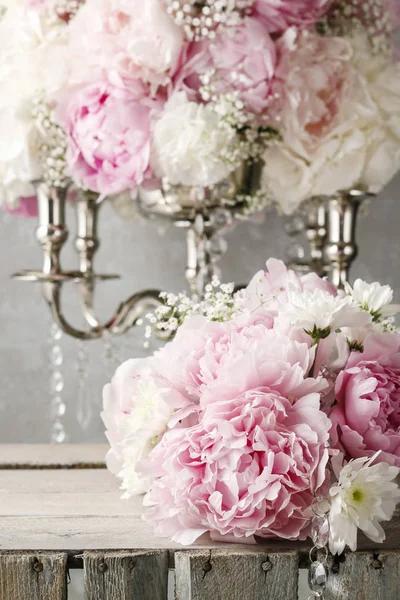 Floral arrangement with pink peonies