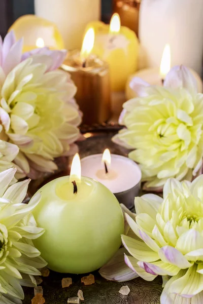 Candles and golden dahlias — Stock Photo, Image