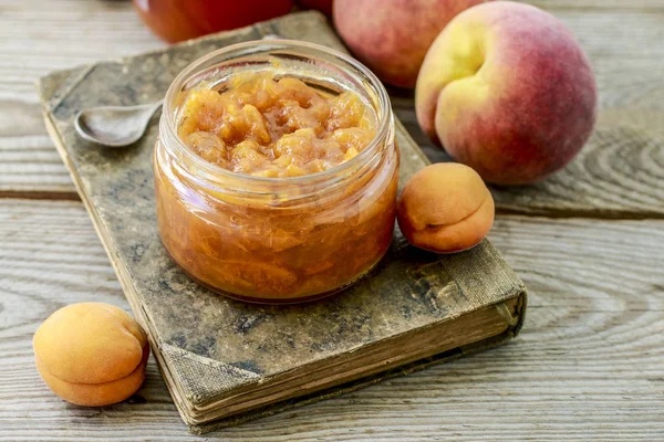 Jar of peach jam — Stock Photo, Image