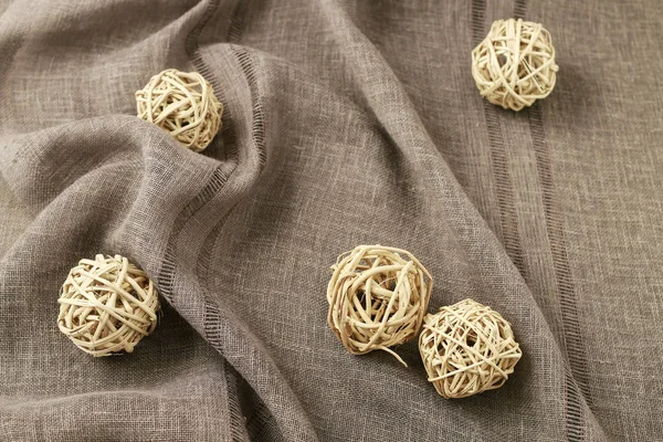 Bolas de mimbre sobre tela de lino —  Fotos de Stock