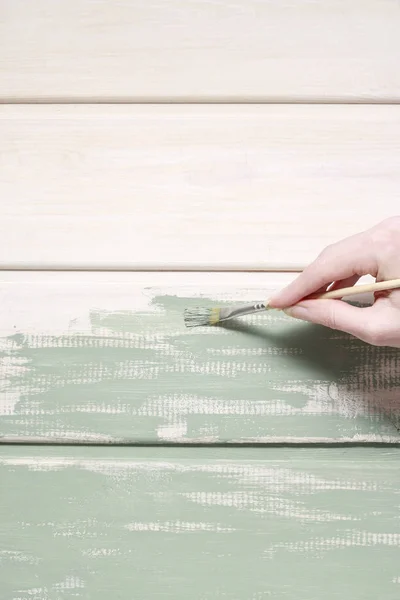 Woman painting wood — Stock Photo, Image