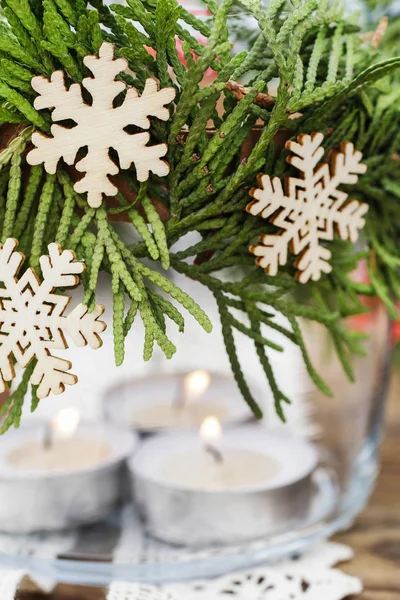 Decorative christmas jar for candles with thuja twigs wreath and — Stock Photo, Image