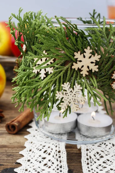 Decorative christmas jar for candles with thuja twigs wreath and — Stock Photo, Image