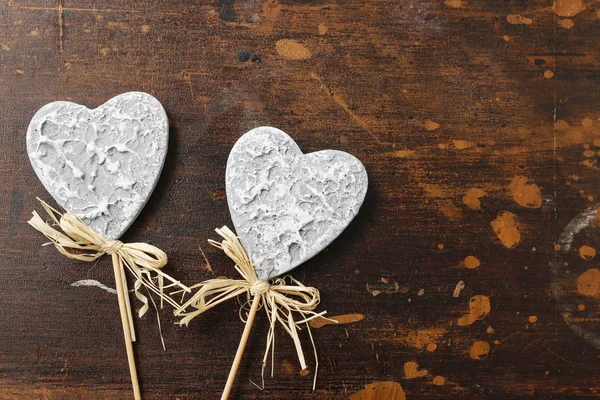 Grey hearts on wooden background — Stock Photo, Image