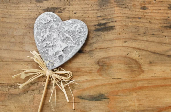 Grey heart on wooden background — Stock Photo, Image