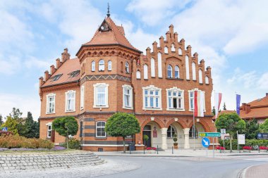 NIEPOLOMICE,POLAND - JULY 12, 2019: A historic brick building in clipart