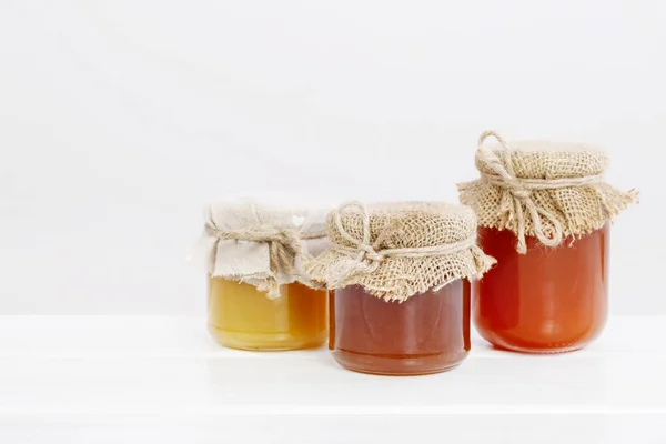 Jars with honey isolated on white background. — ストック写真