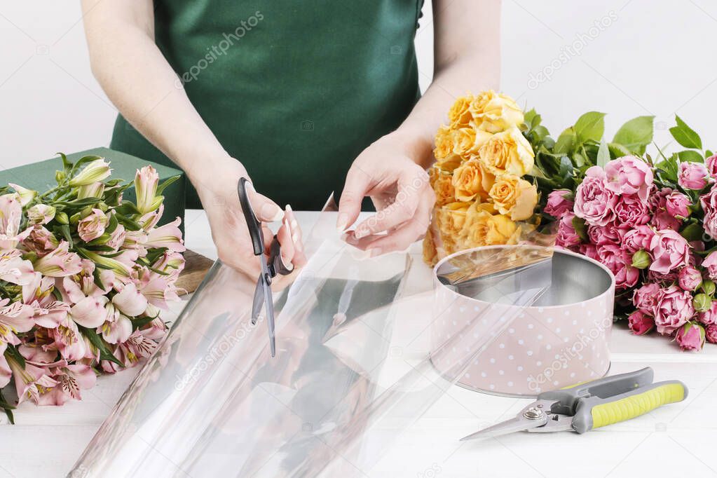 Woman shows how to make floral arrangement