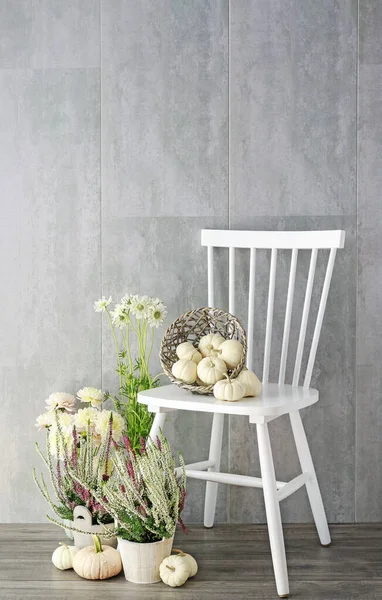 White wooden chair and autumn home decoration with baby boo pump — Stock Photo, Image