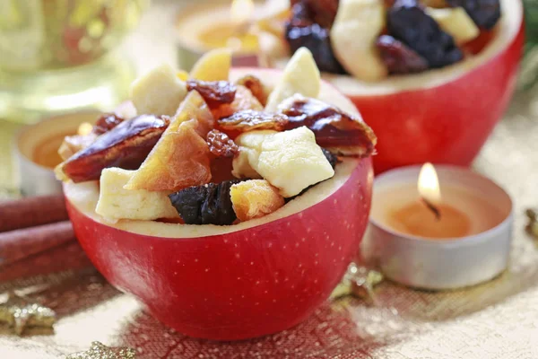 Red Christmas apples stuffed with dried fruits in honey. — Stock Photo, Image