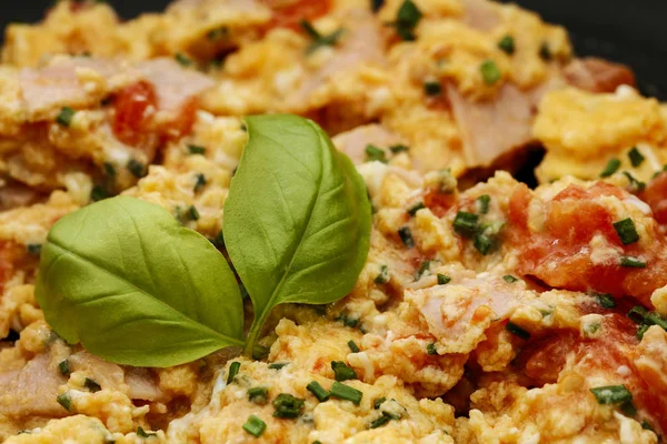 Consecutive steps of preparing scrambled eggs with tomatoes and — Stok fotoğraf