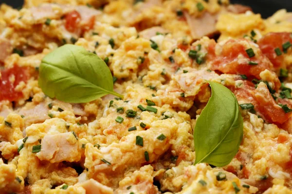 Consecutive steps of preparing scrambled eggs with tomatoes and — Stok fotoğraf